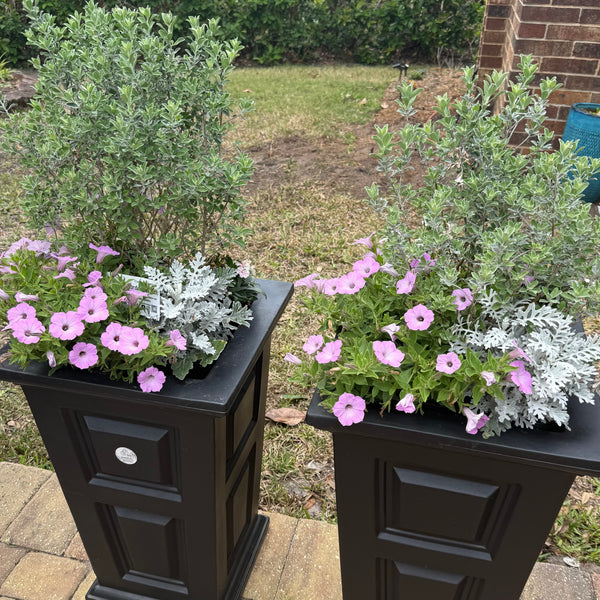 Decorative planters shaped with flowers on a patio