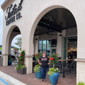 India standing in front of foxtail coffee